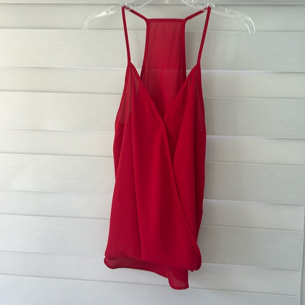 Red top, think straps, race back.